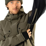 Beyond Medals Cargo Shell 2L Jacket 2025 - A khaki green jacket with a black zipper and two chest pockets.
