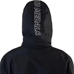 Beyond Medals The Jacket Shell 2025 - A black jacket with a white logo on the chest and a hood.
