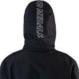 Beyond Medals The Jacket Shell 2025 - A black jacket with a white logo on the chest and a hood.