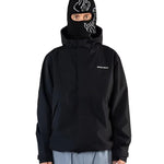 Beyond Medals The Jacket Shell 2025 - A black jacket with a white logo on the left chest and a zipper running down the middle.