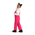 Obermeyer Junior's Snoverall Insulated Bib Pant 2025 - A pair of bright pink snow pants with a bib design, featuring silver zippers and adjustable straps on the shoulders.