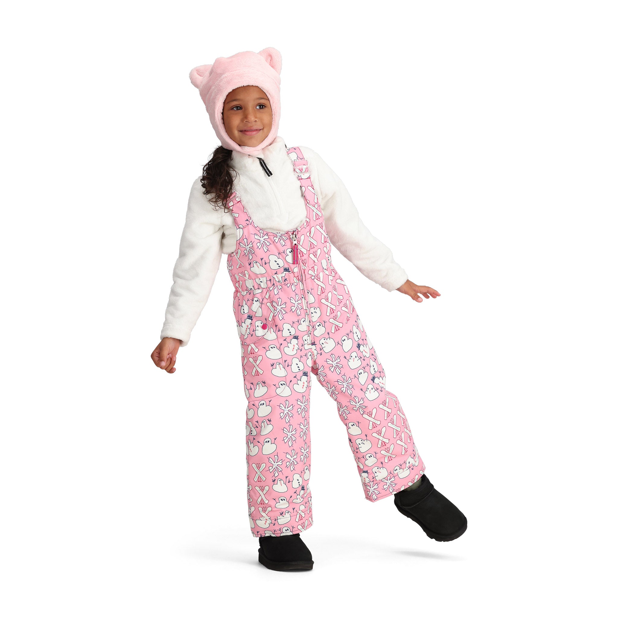 Obermeyer Junior's Snoverall Insulated Print Bib - A pink overall with a repeating pattern of white snowmen, bows, and hearts.
