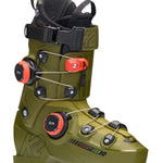 The K2 Cortex 130 Zonal BOA ski boots are displayed prominently against a white background. The boots feature a camouflage design with black straps and buckles, providing a secure fit for the wearer.