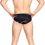 Speedo Infinite Pulse Brief Swimsuit - A black swimsuit with a red, white, and blue wave pattern on the front.