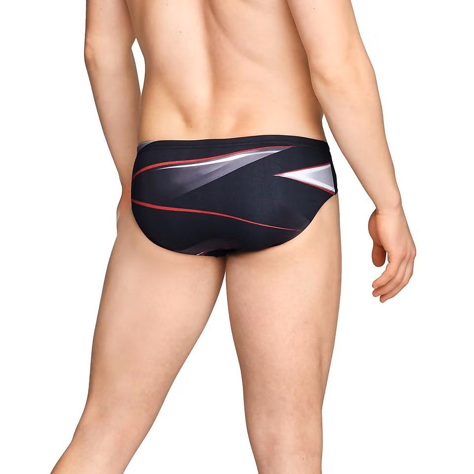 Speedo Infinite Pulse Brief Swimsuit - A black swimsuit with a red, white, and gray geometric pattern on the front.