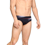 Speedo Infinite Pulse Brief Swimsuit - A black swimsuit with a red, white, and grey geometric pattern on the front.