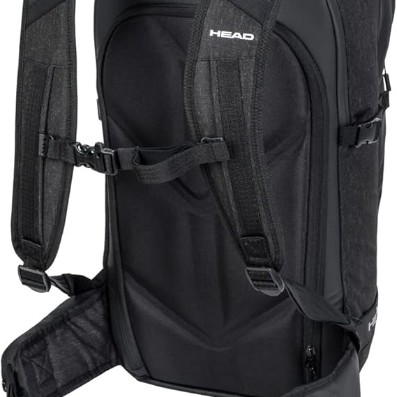 Head Kore Backpack 2023 - Black backpack with white logo on top, zippered pockets, and adjustable straps.