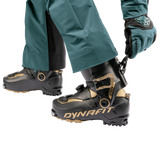 Dynafit Ridge Pro 120 Alpine Touring Boot 2025 - Black boot with gold accents and a circular logo on the side.