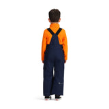 Obermeyer Junior's Volt Insulated Pant 2025 - A pair of navy blue insulated ski pants with a white logo on the left leg and adjustable straps at the waist.