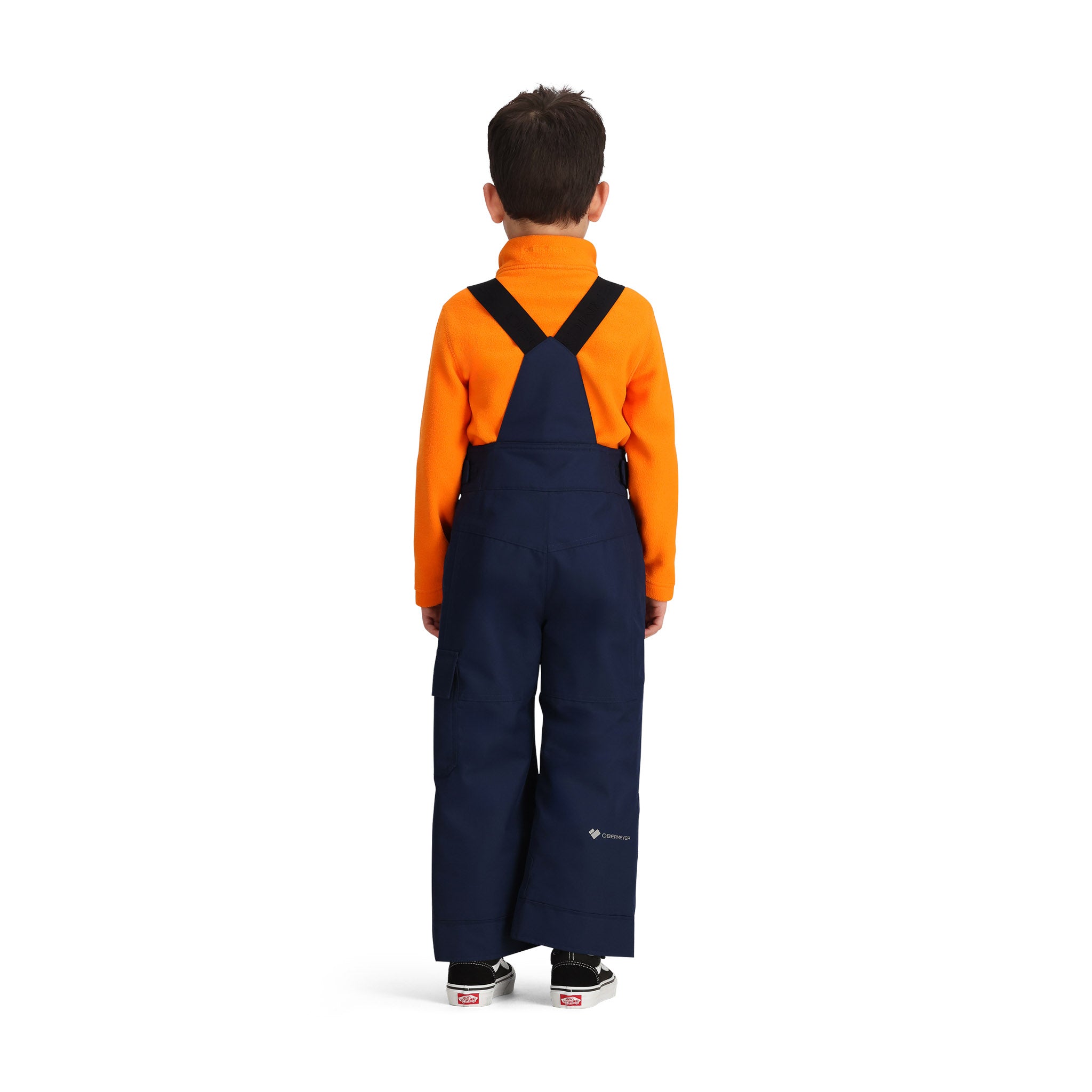 Obermeyer Junior's Volt Insulated Pant 2025 - A pair of navy blue insulated ski pants with a white logo on the left leg and adjustable straps at the waist.