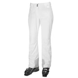 Helly Hansen Women's Legendary Insulated Pant 2025 - A pair of white ski pants with two black buttons on the waistband, featuring a zippered pocket on the right thigh and a small logo patch on the left leg.