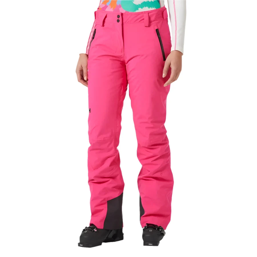 Helly Hansen Women's Legendary Insulated Pant 2025 - A pair of bright pink snow pants with black zippers and a black belt loop on the waistband.