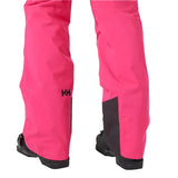 Helly Hansen Women's Legendary Insulated Pant 2025 - A pair of bright pink snow pants with a black logo on the left leg and black trim at the bottom.