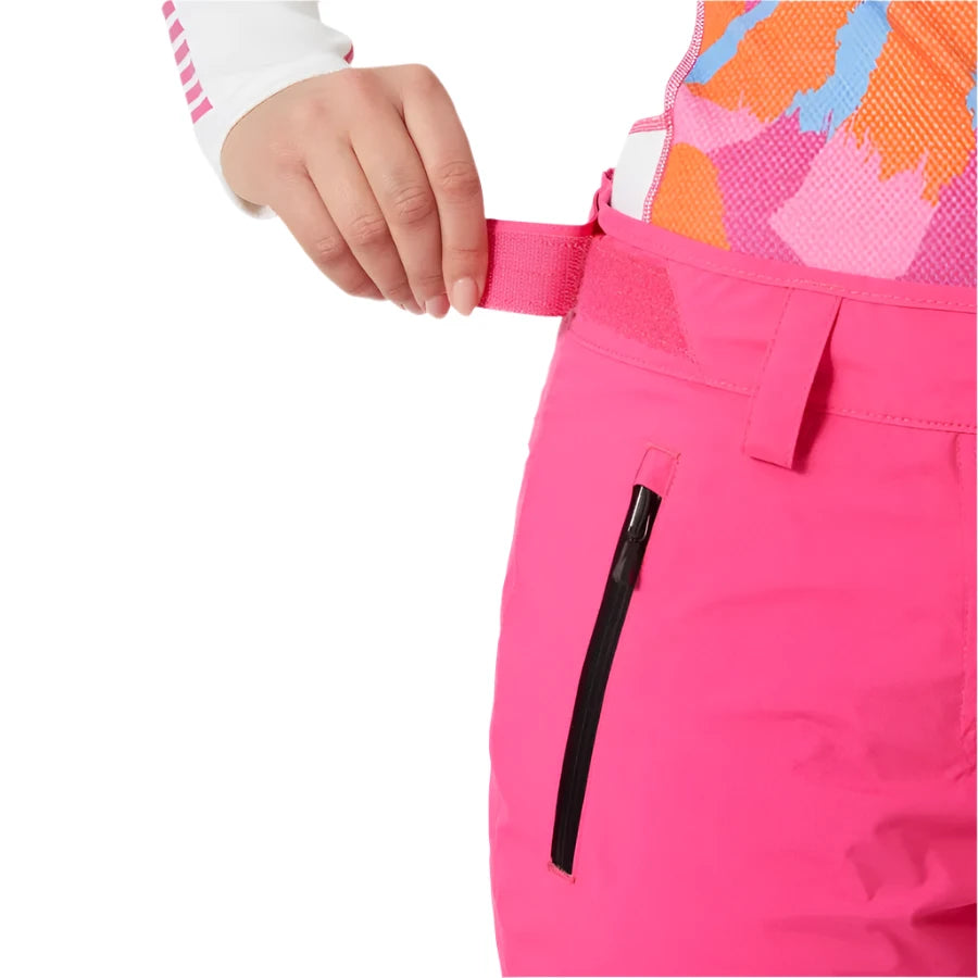 Helly Hansen Women's Legendary Insulated Pant - A pair of bright pink snow pants with a zippered pocket on the right thigh and a black zipper pull.