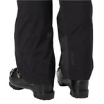 Helly Hansen Women's Legendary Insulated Pant 2025 - Black insulated ski pants with a subtle logo on the left thigh and zippered pockets at the back.