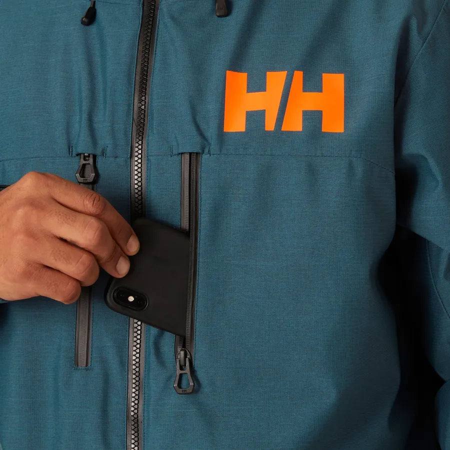 Helly Hansen Garbaldi 2.0 Insulated Jacket - A blue jacket with a white logo on the left chest and two zippered pockets on either side of the waist.