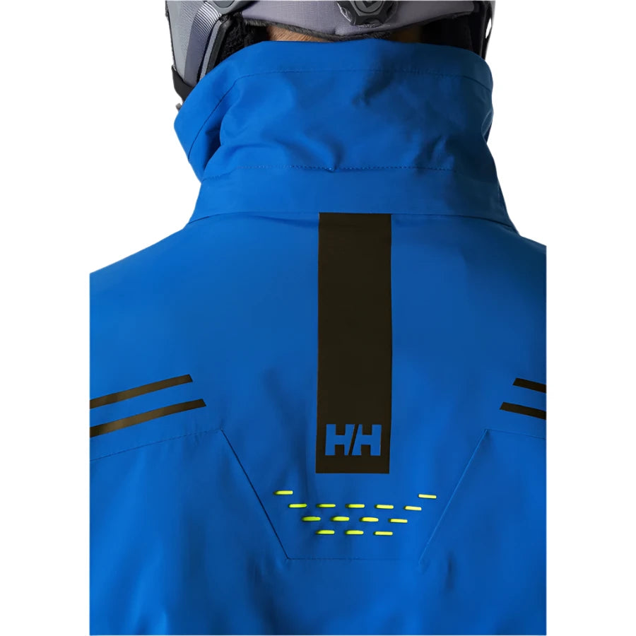 Helly Hansen Alpha Infinity Insulated Jacket 2025 - A royal blue jacket with a black logo on the back and two zippered pockets on either side.