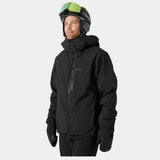 Helly Hansen - A black jacket with a zippered chest pocket and two zippered side pockets, featuring a hood and adjustable cuffs.