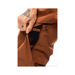 The Quantum Therm Pant by Mons from 2022 is brown with an insulated, zippered pocket on the side.