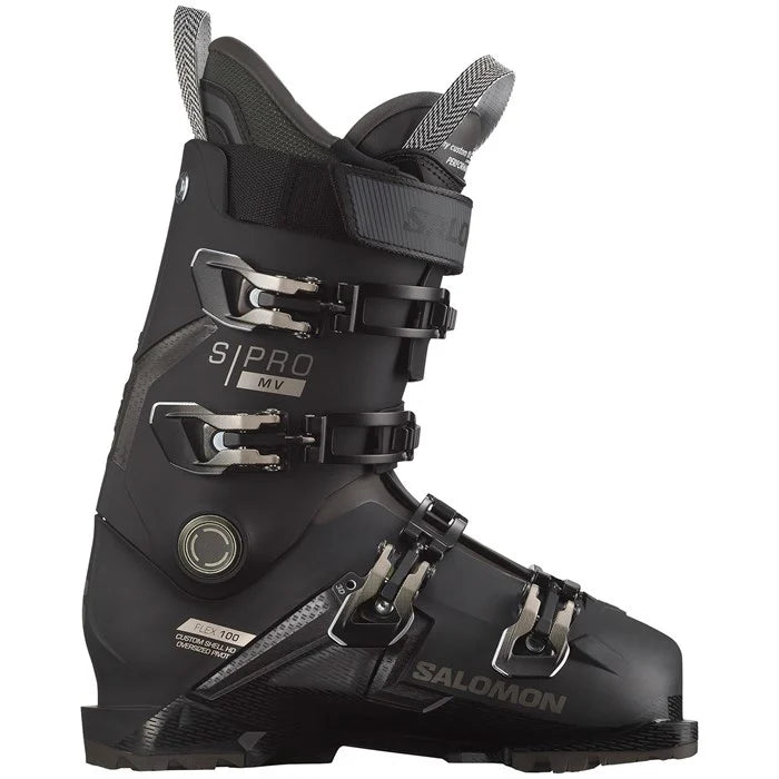 Salomon S-Pro-MV-100-Ski-Boots-2024 - Black ski boots with silver buckles and straps, featuring a textured pattern on the side.