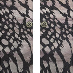 REPTILIOUS CREW SOCK 2024 - A pair of crew socks with a reptile skin pattern in shades of brown and tan.