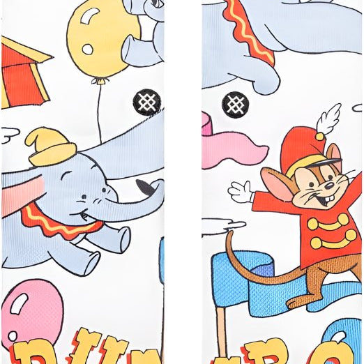 Stance Disney 100 Dumbo By Travis Millard Crew Sock - A pair of crew socks featuring an illustration of Dumbo flying with a circus tent in the background.