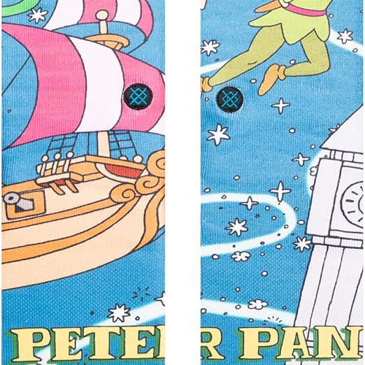 PETER PAN BY TRAVIS C SOCK 2023 - A pair of socks featuring Peter Pan flying above a city skyline at night, with a full moon in the sky and stars scattered throughout.