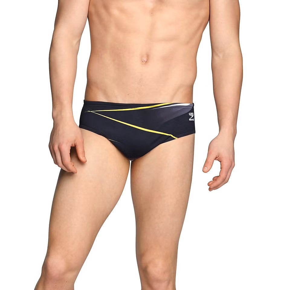 Speedo Infinite Pulse Brief Swimsuit - A black swimsuit with a geometric pattern of yellow and white lines on the front.