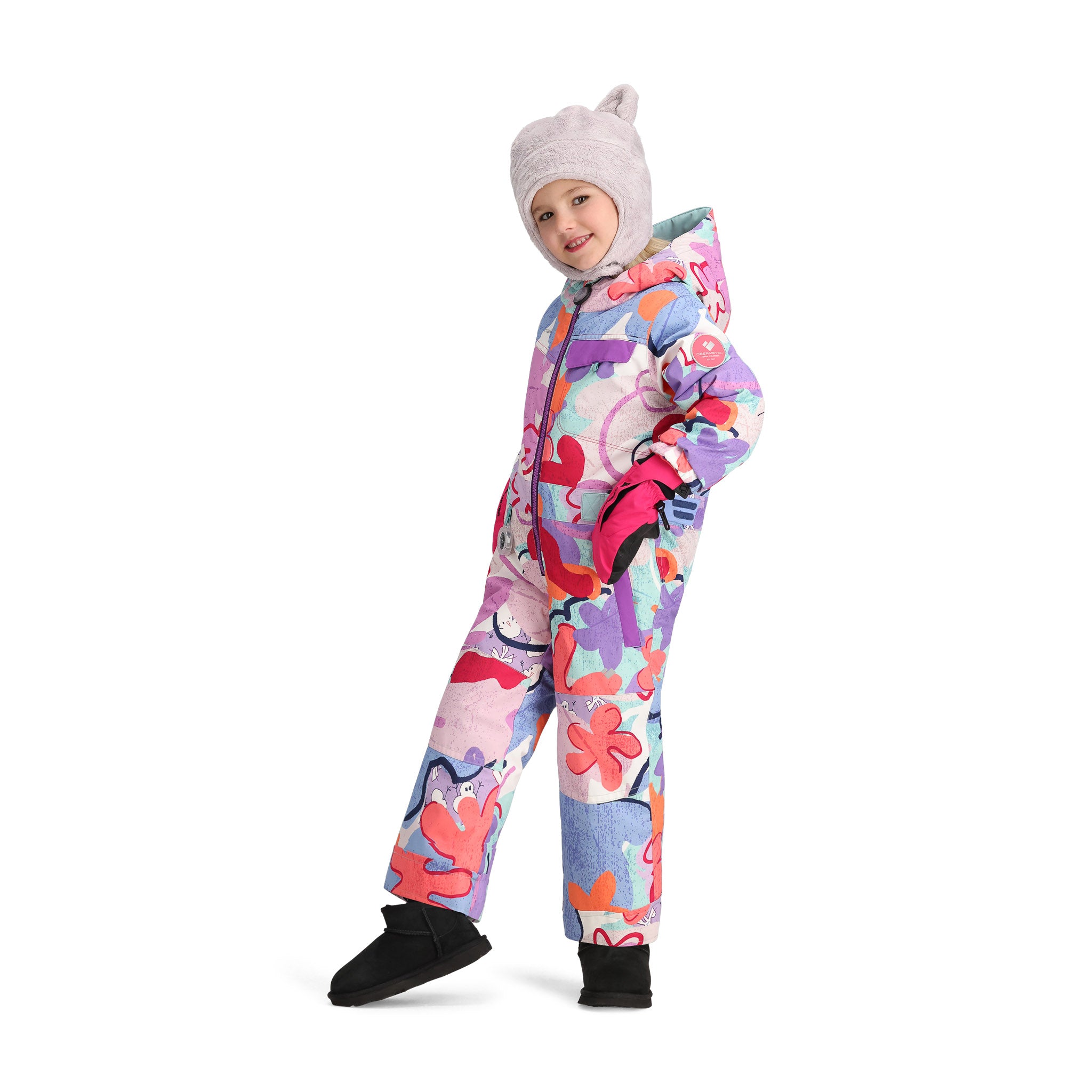 Obermeyer Junior's Quinn Insulated One-Piece Suit 2025 - A pastel blue snowsuit with a white and pink abstract floral pattern, featuring a hood and zip closure.