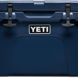 Yeti Tundra 35 Hard Cooler - A navy blue cooler with a handle on top and two latches on either side of it.
