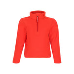 Obermeyer Junior's Ultra Gear Zip Top 2025 - A coral-colored zip-up fleece top with a high collar and zipper running down the front, featuring a small logo on the left shoulder.