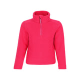 Obermeyer Junior's Ultra Gear Zip Top 2025 - A bright pink zip-up fleece top with a high collar and two small zippered pockets on either side of the chest.