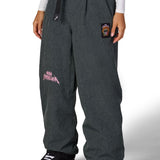 Women's dark gray wide-leg shell pants with elastic waistband and side graphics