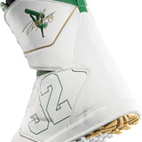 ThirtyTwo Lashed Double BOA x Powell Snowboard Boot 2025 - A white snowboard boot with green accents and a gold logo on the side.