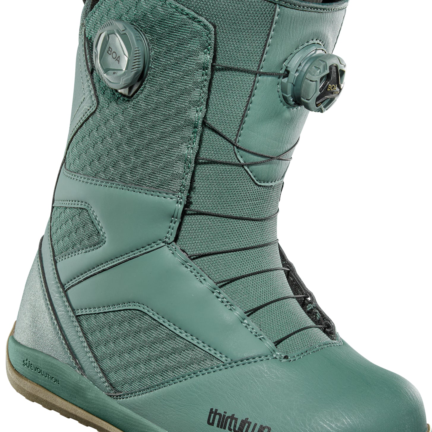 ThirtyTwo STW Double BOA Snowboard Boot 2025 - A pair of snowboard boots with a predominantly black upper and a brown sole, featuring two circular BOA dials on each side.