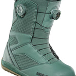 ThirtyTwo STW Double BOA Snowboard Boot 2025 - A pair of snowboard boots with a predominantly black upper and a brown sole, featuring two circular BOA dials on each side.