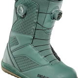 ThirtyTwo STW Double BOA Snowboard Boot 2025 - A pair of snowboard boots with a predominantly black upper and a brown sole, featuring two circular BOA dials on each side.