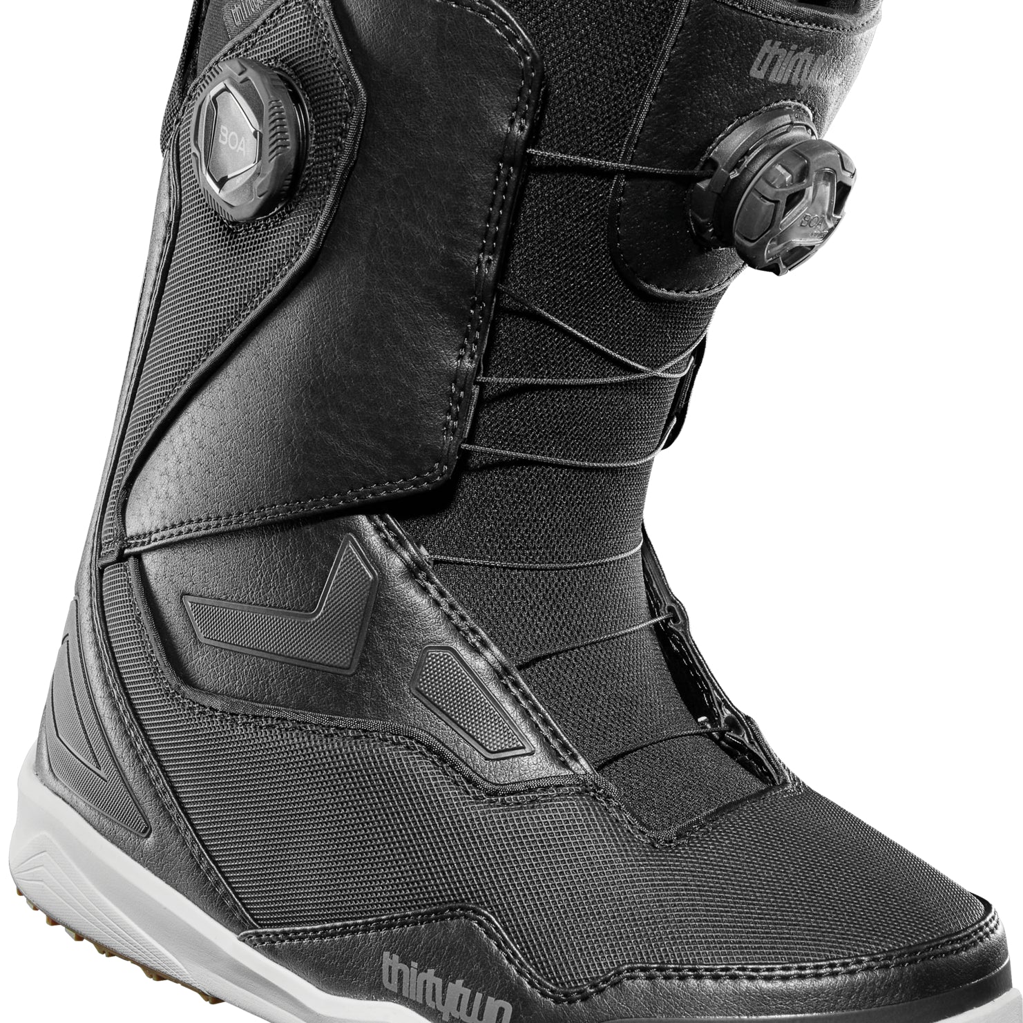 ThirtyTwo TM-2 Double BOA Wide Snowboard Boot 2025 - Black snowboard boots with a textured pattern on the side and white soles.
