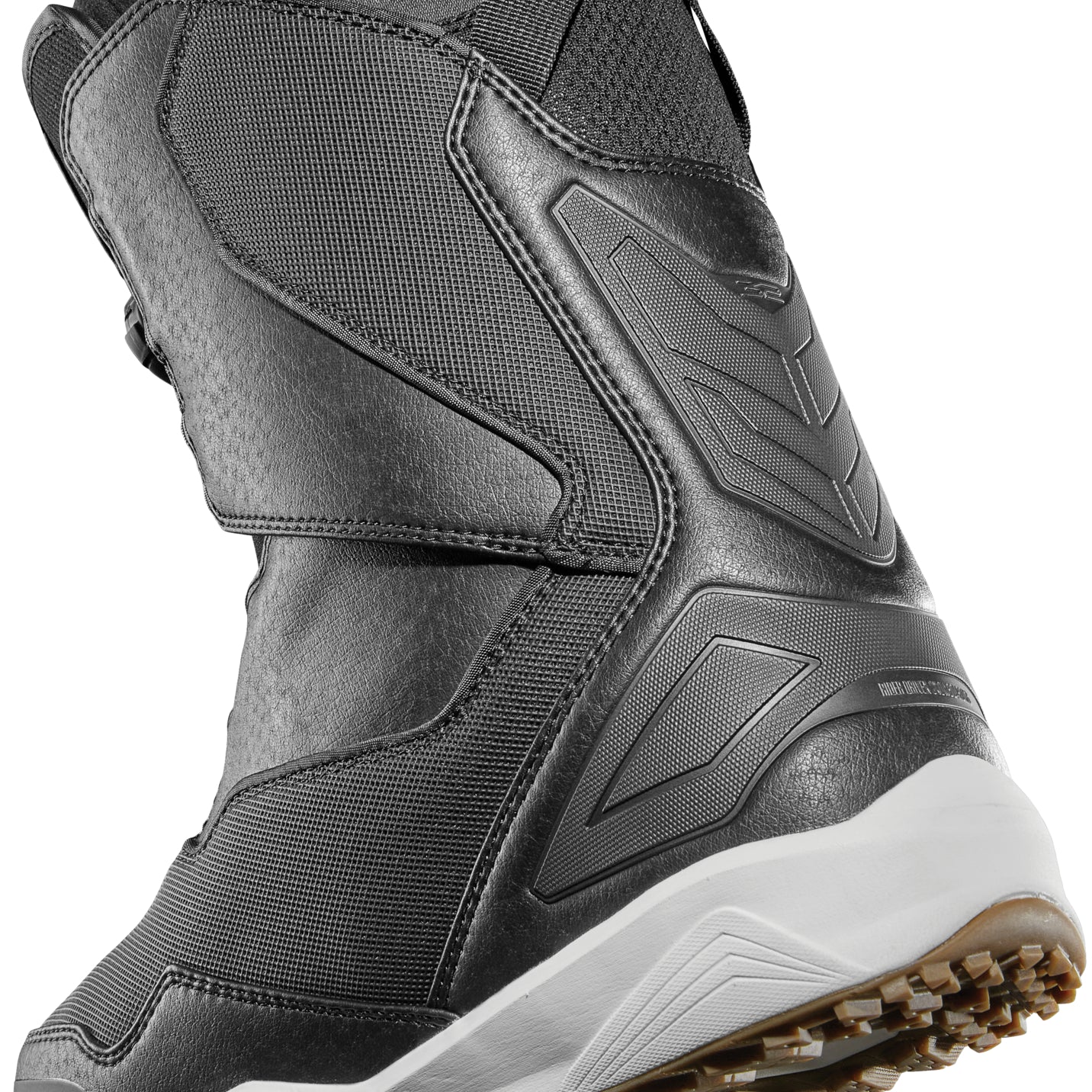 ThirtyTwo TM-2 Double BOA Wide Snowboard Boot 2025 - A black snowboard boot with a textured pattern on the side and a white sole.