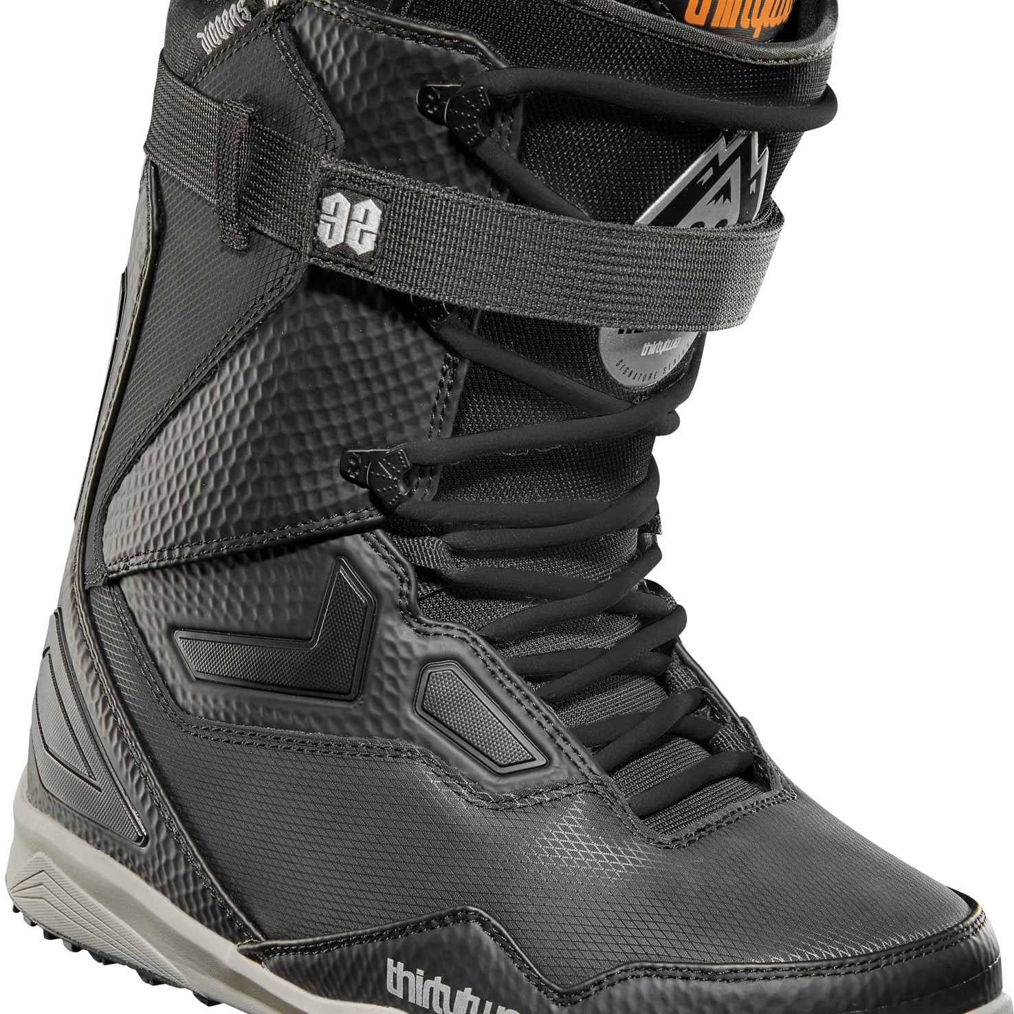 ThirtyTwo TM-2 XLT X Helgason Snowboard Boot 2025 - Black snowboard boot with white accents and a textured pattern on the side.
