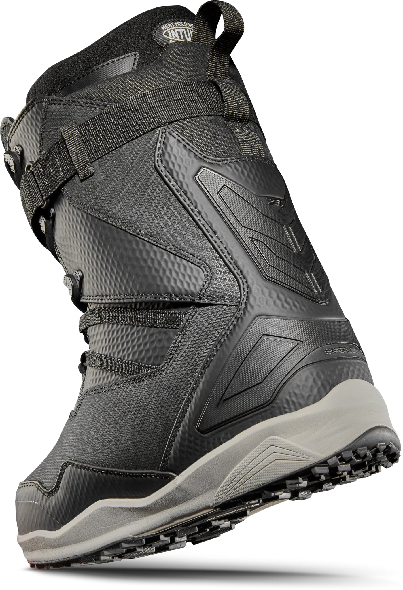 ThirtyTwo TM-2 XLT X Helgason Snowboard Boot 2025 - A black snowboard boot with a textured pattern on the side and a white logo on the tongue.