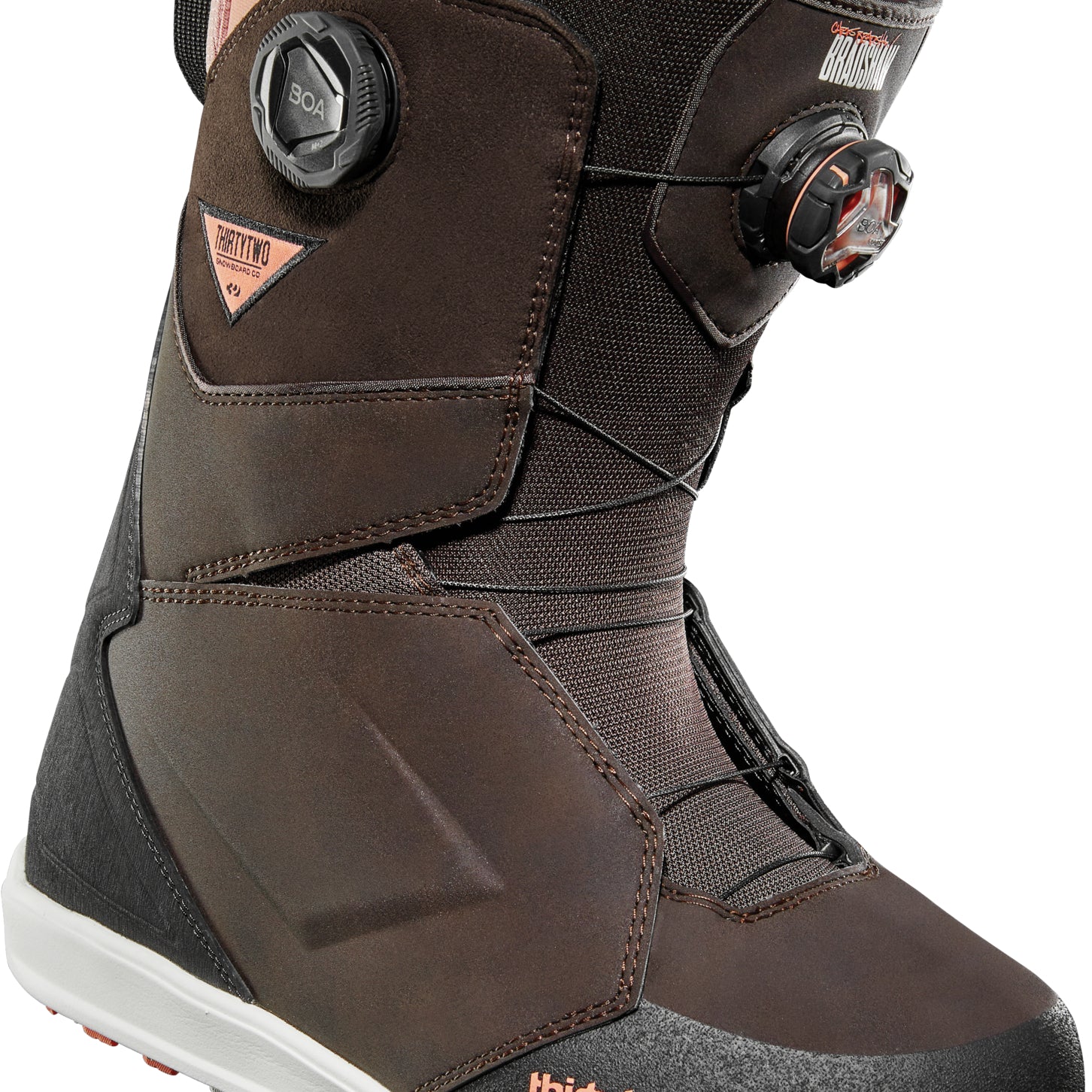 ThirtyTwo Lashed Double BOA Wide Snowboard Boot 2025 - A brown snowboard boot with a pink lining and black laces, featuring two circular BOA dials on either side of the ankle.