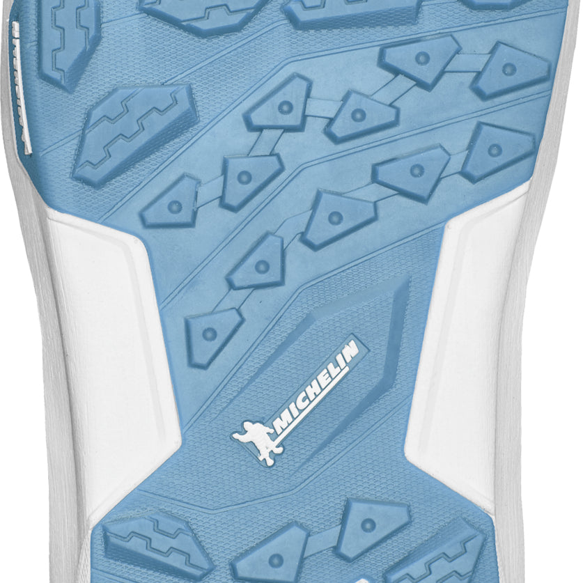 ThirtyTwo TM-2 x Bomb Hole Snowboard Boot 2025 - A light blue snowboard boot with a textured pattern on the sole and a white logo that reads "Bomb Hole" in bold letters.