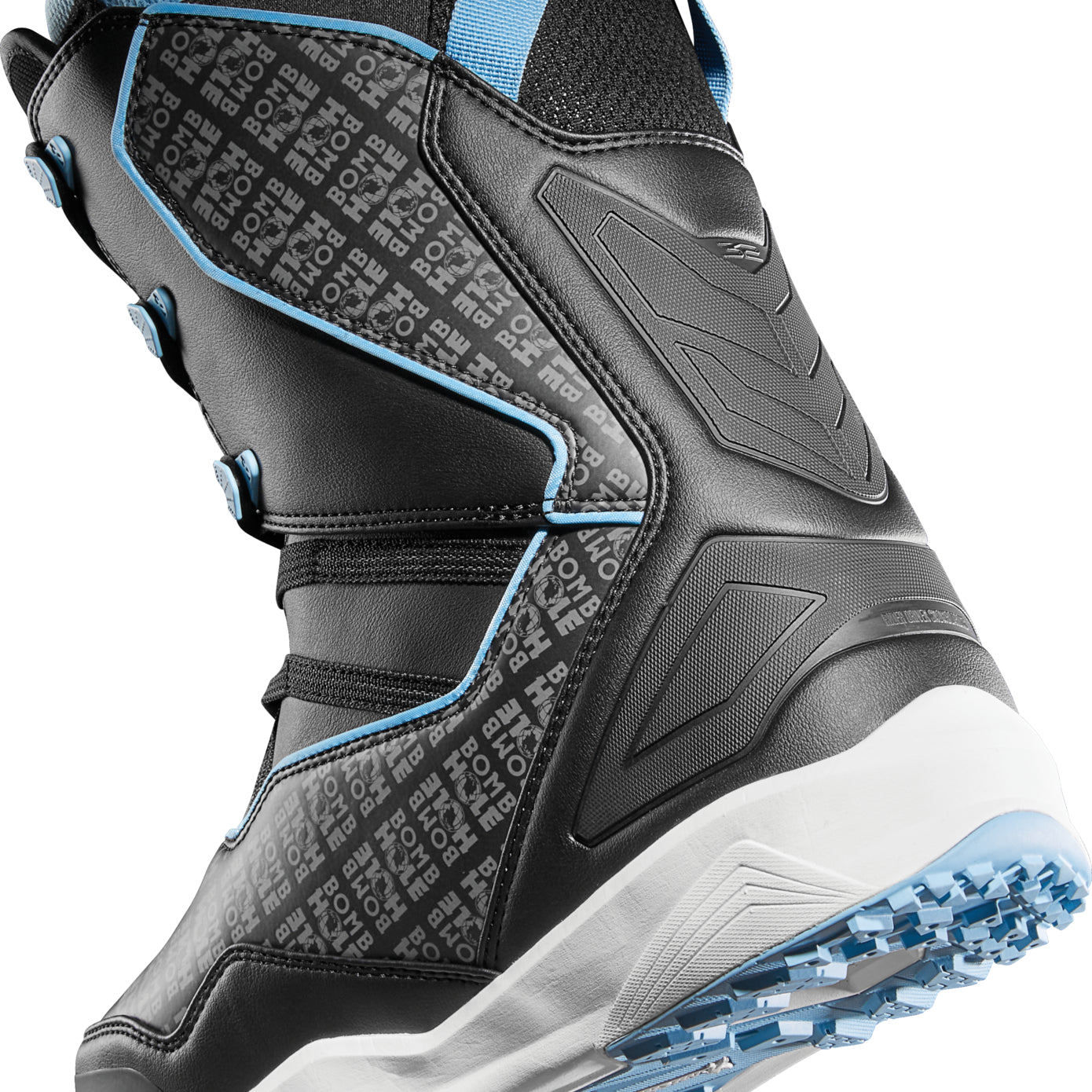 ThirtyTwo TM-2 x Bomb Hole Snowboard Boot 2025 - Black snowboard boots with a blue strap and white accents.