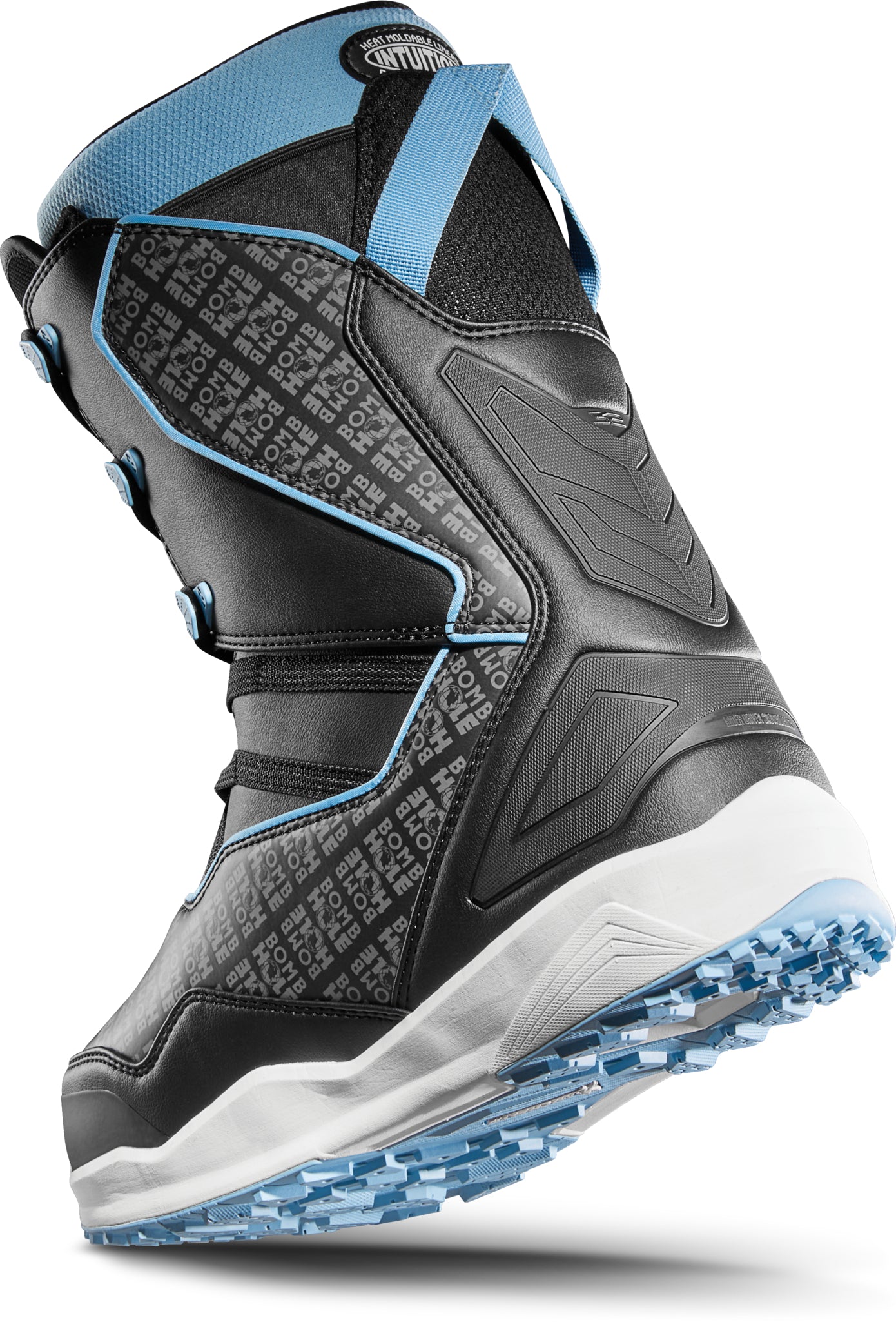 ThirtyTwo TM-2 x Bomb Hole Snowboard Boot 2025 - Black snowboard boots with a blue strap and white accents.