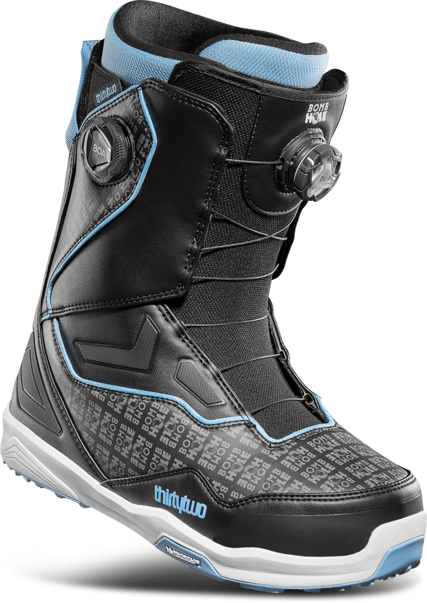 ThirtyTwo TM-2 Double BOA X Bomb Hole Snowboard Boot 2025 - Black snowboard boots with white accents and a repeating "Bomb Hole" pattern on the toe box.