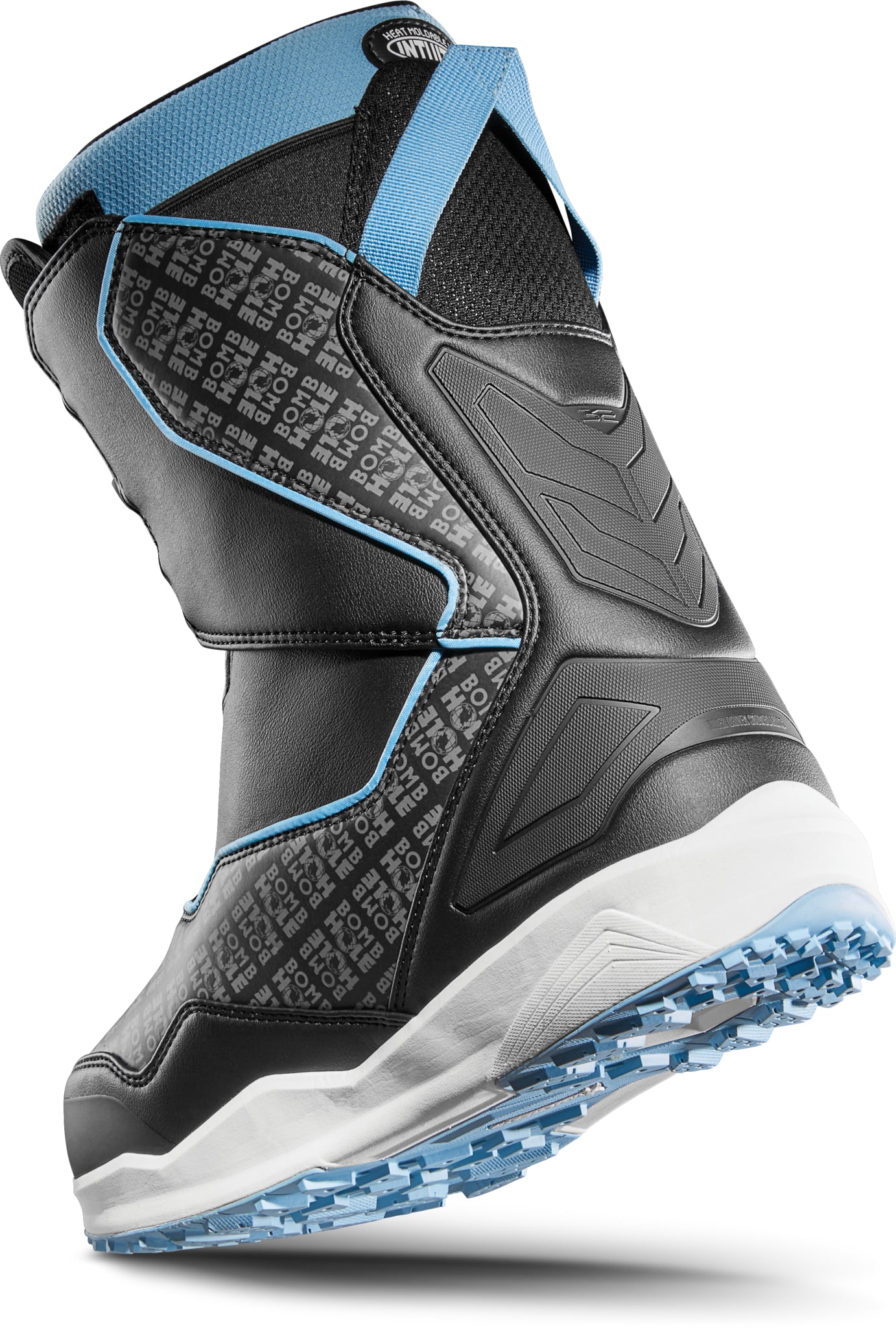 ThirtyTwo TM-2 Double BOA X Bomb Hole Snowboard Boot 2025 - Black snowboard boot with a textured pattern on the side and blue accents around the ankle strap.