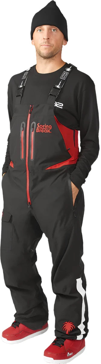 ThirtyTwo Spring Break x Powder Shell Bib 2024 - Black bib with red accents and a palm tree logo on the left leg.