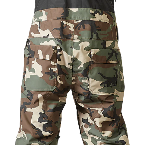 ThirtyTwo Basement Shell Bib Pant 2024 - Black bib shell pant with white and grey snow camo pattern on lower legs.