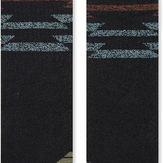 Stance Blanket Statement Socks 2023 - A pair of black socks with a repeating pattern of horizontal stripes in shades of brown and blue.
